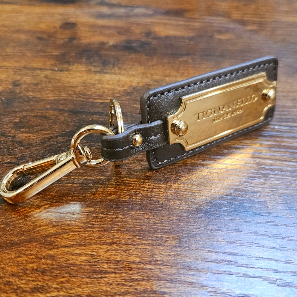 Tignanello leather and gold tone bag charm key ring